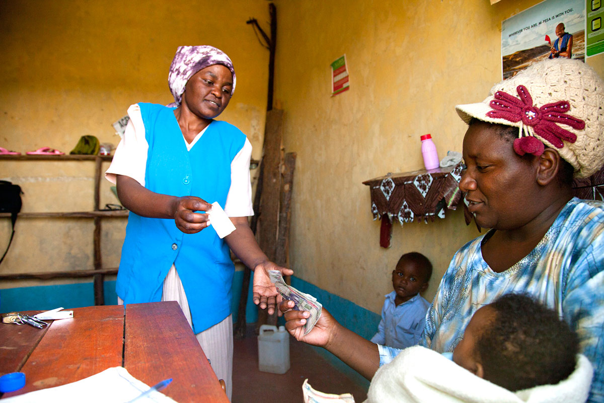 Healthcare worker providing trusted information to community members in clinic